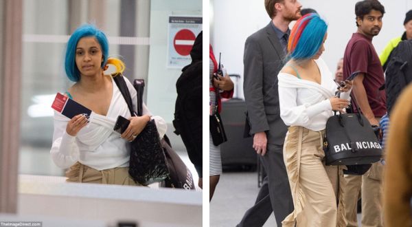 Cover Image for Cardi B rocks rainbow wig for flight to Italy… before joining nemesis Nicki Minaj at Milan Fashion Week
